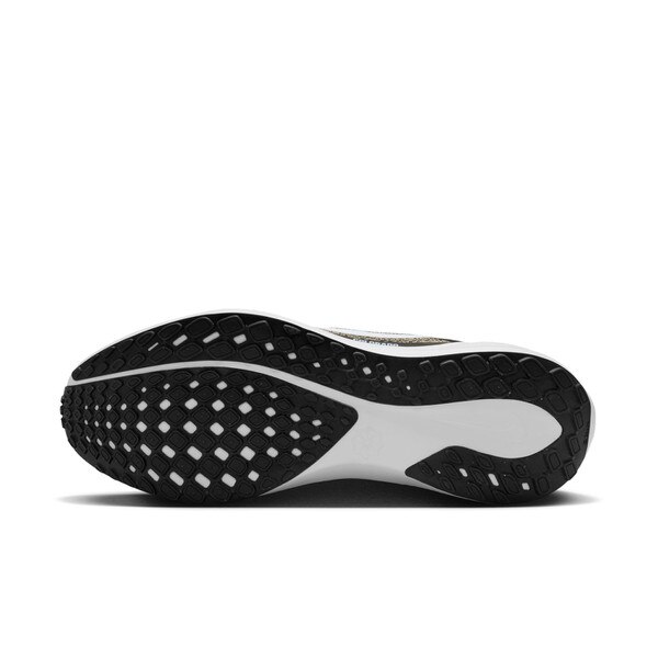 Bottom view of black Nike Air Zoom running shoe with white outsole and textured black rubber tread pattern